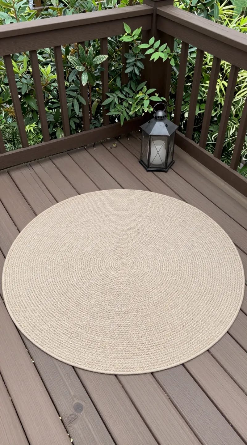 round outdoor rug on WPC terrace with lanterns
